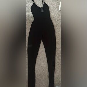 Pretty little thing- black jump suit brand new size xsmall women’s - petite